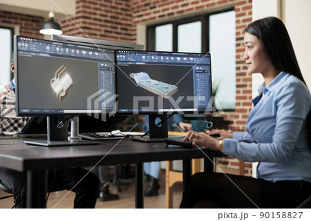 Digital creator improving prototype mesh using advanced computer and software while sketching 3D scene. Skilled creative professional creating digital model while solving technical issues. Digital creator improving prototype mesh using advanced computer and software while sketching 3D scene. Skilled creative professional creating digital model while solving technical issues. 90158827