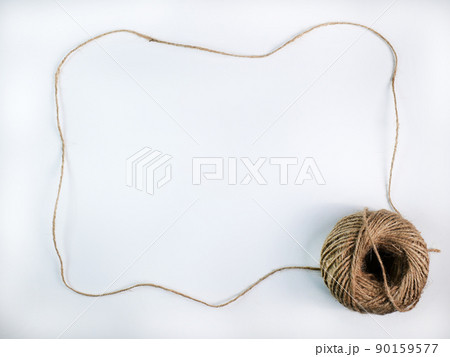 coiled raw rope Made of various fibers into a long rope. is stretched into a frame with a space to insert text in the middle For brown crafts, white background isolated, studio shot. coiled raw rope Made of various fibers into a long rope. is stretched into a frame with a space to insert text in the middle For brown crafts, white background isolated, studio shot. 90159577