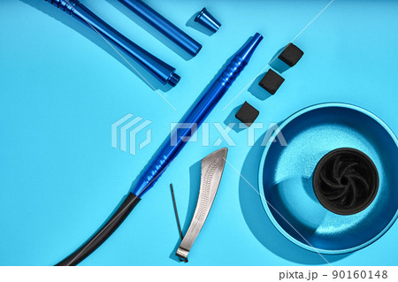 Top view of Hookah parts on light blue background 90160148