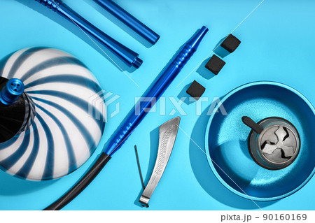 Top view of Hookah parts on light blue background 90160169