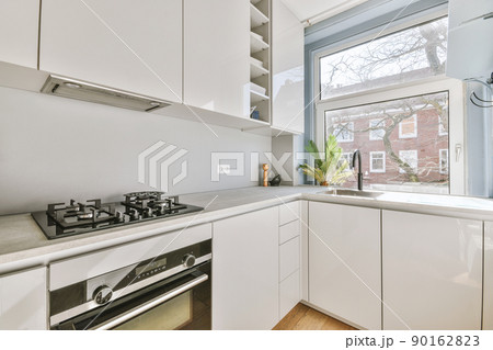 Interior of a kitchen in modern apartment Interior of a kitchen in modern apartment 90162823