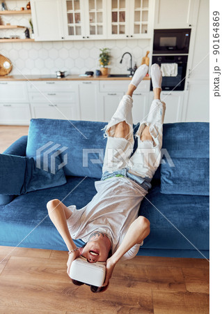 Guy wearing vr headset while enjoying spending leisure free time 90164869