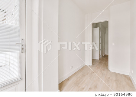 Spacious hallway interior with parquet floor and entrance to the cozy house Spacious hallway interior with parquet floor and entrance to the cozy house 90164990