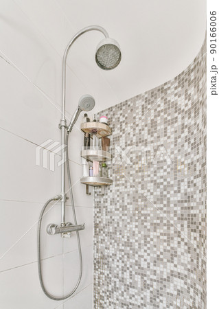 Modern shower stall in a bright bathroom Modern shower stall in a bright bathroom 90166006