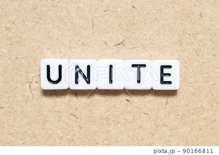 White tile alphabet letter with word unite on wood background 90166811