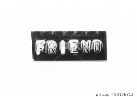 Black color banner that have embossed letter with word friend on white paper background 90166812