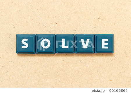 Tile alphabet letter in word solve on wood background 90166862