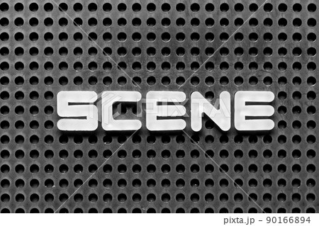 White alphabet letter in word scene on black pegboard background White alphabet letter in word scene on black pegboard background 90166894