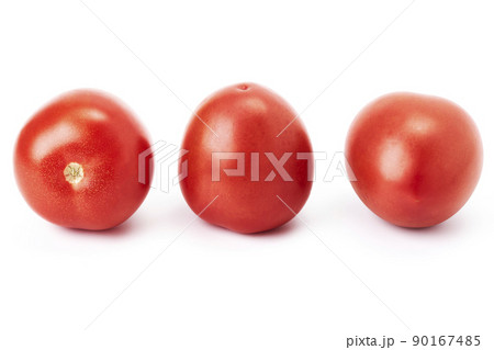 Three ripe red cherry tomatoes on a white background Three ripe red cherry tomatoes on a white background 90167485