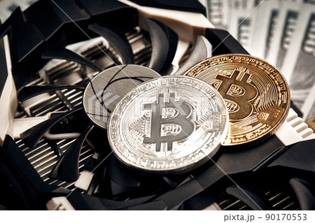 The coin of bitcoin lies on video card with dollars. Exchange bitcoin cash for a dollar 90170553