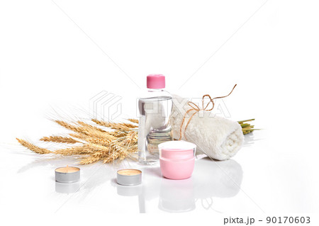 Herbal and mineral skincare. Jar of cream, oil with wheat, cosmetic bottles. Without label Herbal and mineral skincare. Jar of cream, oil with wheat, cosmetic bottles. Without label 90170603