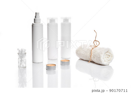 Set of cosmetic products in white containers on light background. Set of cosmetic products in white containers on light background. 90170711