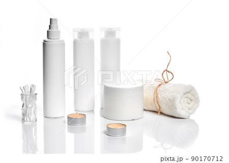 Set of cosmetic products in white containers on light background. Set of cosmetic products in white containers on light background. 90170712