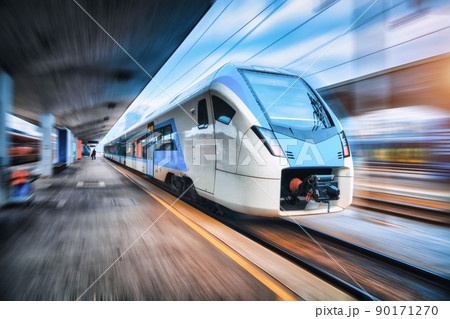 High speed train in motion on the railway station at sunset 90171270