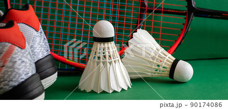 Badminton sports equipments, racket, shuttlecocks and shoes, on court, 90174086