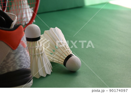Badminton sports equipments, racket, shuttlecocks and shoes, on court, Badminton sports equipments, racket, shuttlecocks and shoes, on court, 90174097