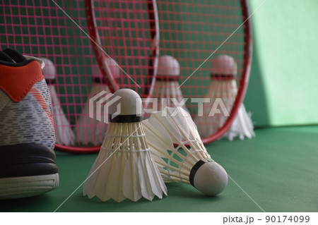 Badminton sports equipments, racket, shuttlecocks and shoes, on court, Badminton sports equipments, racket, shuttlecocks and shoes, on court, 90174099