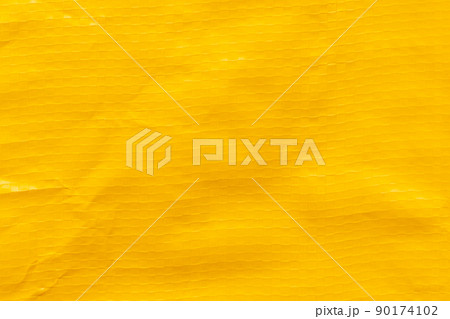 Yellow plastic bag texture background. Yellow plastic bag texture background. 90174102