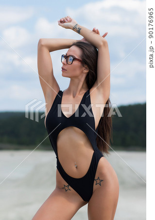 Beautiful woman in swimsuit on beach Beautiful woman in swimsuit on beach 90176965