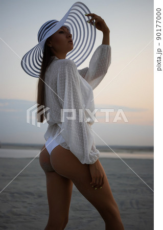 Stylish sensual woman in beachwear and hat 90177000