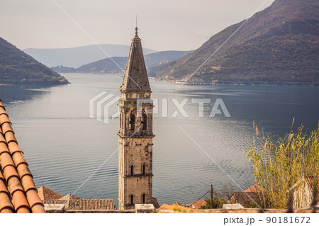 Scenic panorama view of the historic town of Perast at famous Bay of Kotor with blooming flowers on a beautiful sunny day with blue sky and clouds in summer, Montenegro, southern Europe 90181672