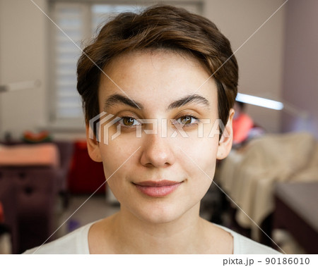 Caucasian woman before procedure in beauty salon.  90186010