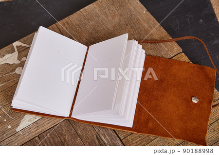 Blank pages of book open with leather soft cover 90188998