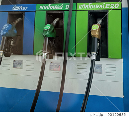 Bangkok, Thailand - May 16, 2022: Thai Petrol pump filling nozzles , Gas station Bangkok, Thailand - May 16, 2022: Thai Petrol pump filling nozzles , Gas station 90190686