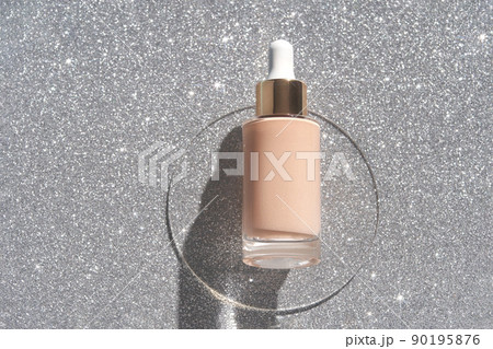 Beige foundation texture swatch. Cream drop with silver sparkles. Face skincare 90195876