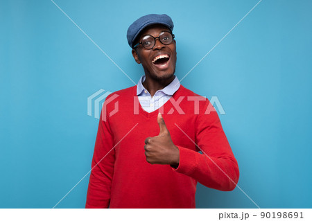 happy african american handsome man laughing and showing thumb up gesture 90198691