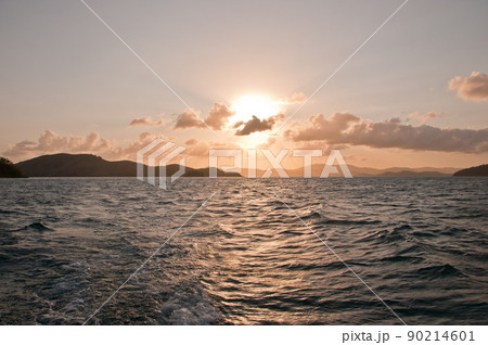 Sunset scene of peaceful serene mountain island in the Pacific Ocean of Hamilton Island in Queensland Australia Sunset scene of peaceful serene mountain island in the Pacific Ocean of Hamilton Island in Queensland Australia 90214601