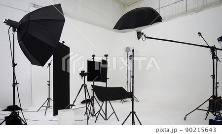 Studio video production lighting set. Behind the scenes shooting production set up by crew team camera and equipment in studio. Video production filming or commercial movie film live streaming online. Studio video production lighting set. Behind the scenes shooting production set up by crew team camera and equipment in studio. Video production filming or commercial movie film live streaming online. 90215643