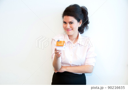 Business woman hold house toy model on white background Business woman hold house toy model on white background 90216635