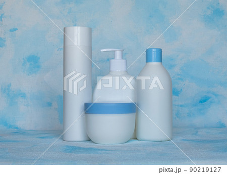 Bottles for cosmetic products without a label. Facial skin care concept. Texture background 90219127