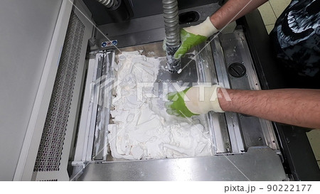 Man cleans details printed on industrial 3D printer from white plastic powder. Automated additive technologies. Person cleans vacuum cleaner plastic powder from models printed on 3D printer. Man cleans details printed on industrial 3D printer from white plastic powder. Automated additive technologies. Person cleans vacuum cleaner plastic powder from models printed on 3D printer. 90222177