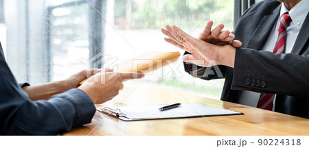 Businessman is refuses don't receive to accept banknote money and terms of contract from corruption bribe employer in signing agreement deal 90224318