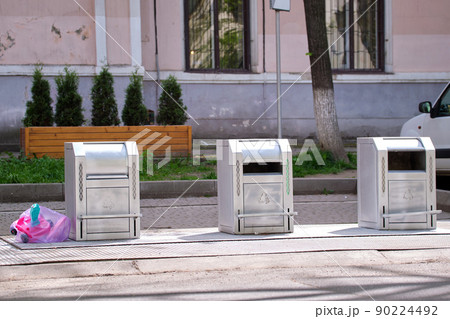 Stainless steel garbage cans for separate disposal of recycle trash on city street 90224492