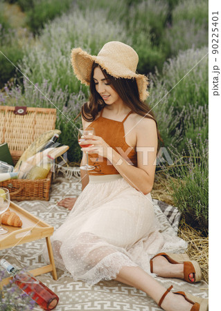 Provence woman relaxing in lavender field. Lady in a picnic. Provence woman relaxing in lavender field. Lady in a picnic. 90225401