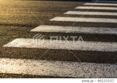 Detail of dangerous road crossing with pedestrian zebra. Safety concept. Detail of dangerous road crossing with pedestrian zebra. Safety concept. 90225557