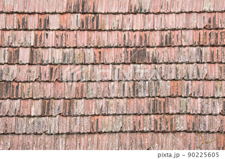 Closeup surface of old weathered ceramic tiles covering building roof 90225605