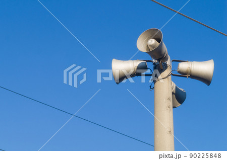 Public address system on the pole. Loudspeakers alerting the public about incidents and giving alarm signals. Outdoor PA speakers. Selective focus 90225848