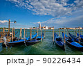 Gondolas and in lagoon of Venice by San Marco square. Venice, Italy 90226434