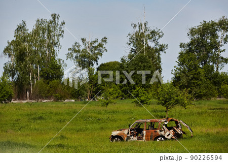 Burnt car of civilians. People were shot by Russian soldiers. May, 2022 90226594