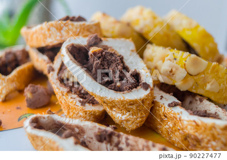 Oriental sweets, pastille roll with sherbet and nuts. Sweet dessert. Soft focus Oriental sweets, pastille roll with sherbet and nuts. Sweet dessert. Soft focus 90227477