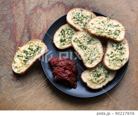 Cheese toasts in a black plate 90227656
