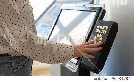 A woman uses a voting device for blind and visually impaired citizens. A woman uses a voting device for blind and visually impaired citizens. 90231704