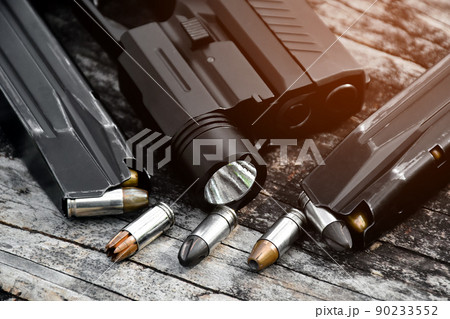 9mm pistol bullets and automatic gun. 9mm pistol bullets and automatic gun. 90233552