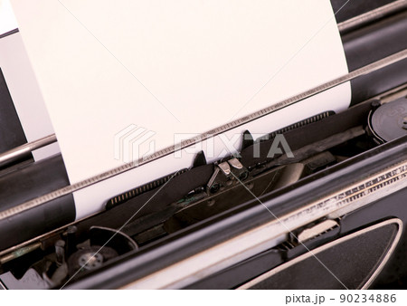 close up image of typewriter with paper sheet. copy space for your text. retro filtered 90234886