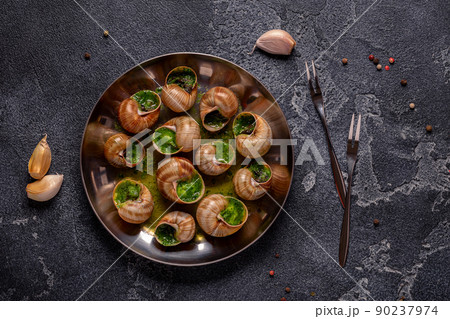 Bourgogne Escargot Snails with herb garlic oil. Bourgogne Escargot Snails with herb garlic oil. 90237974