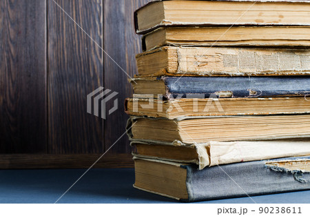 Old books with crumpled, torn covers. Copy space 90238611